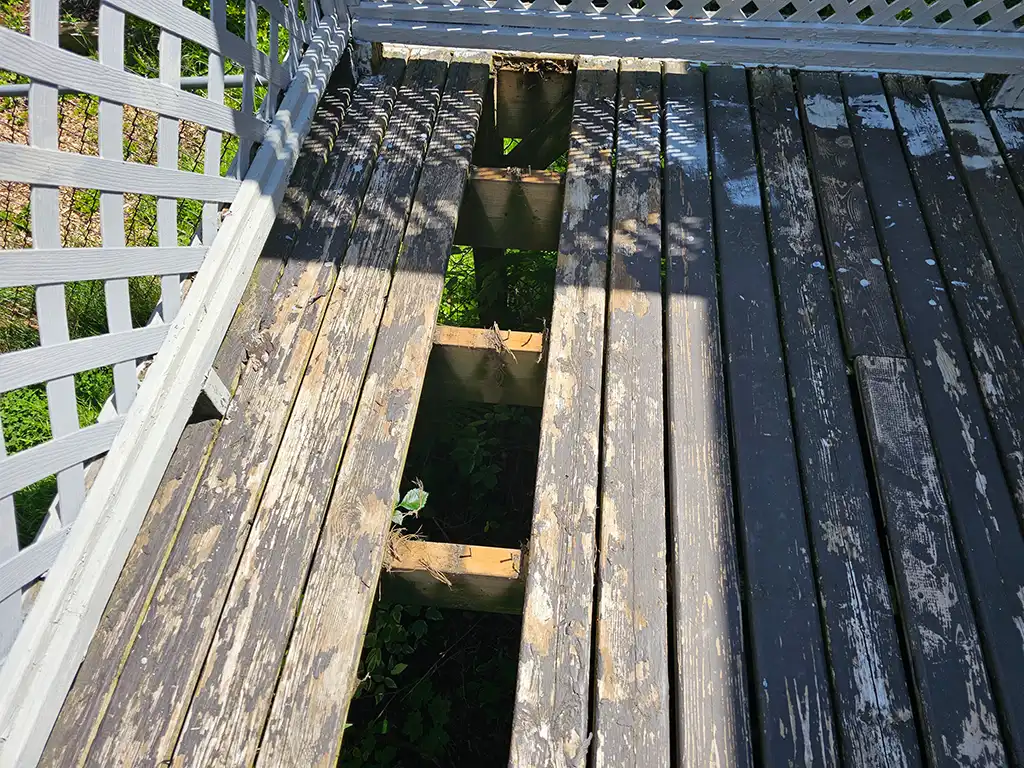 terrible looking deck that needs repair