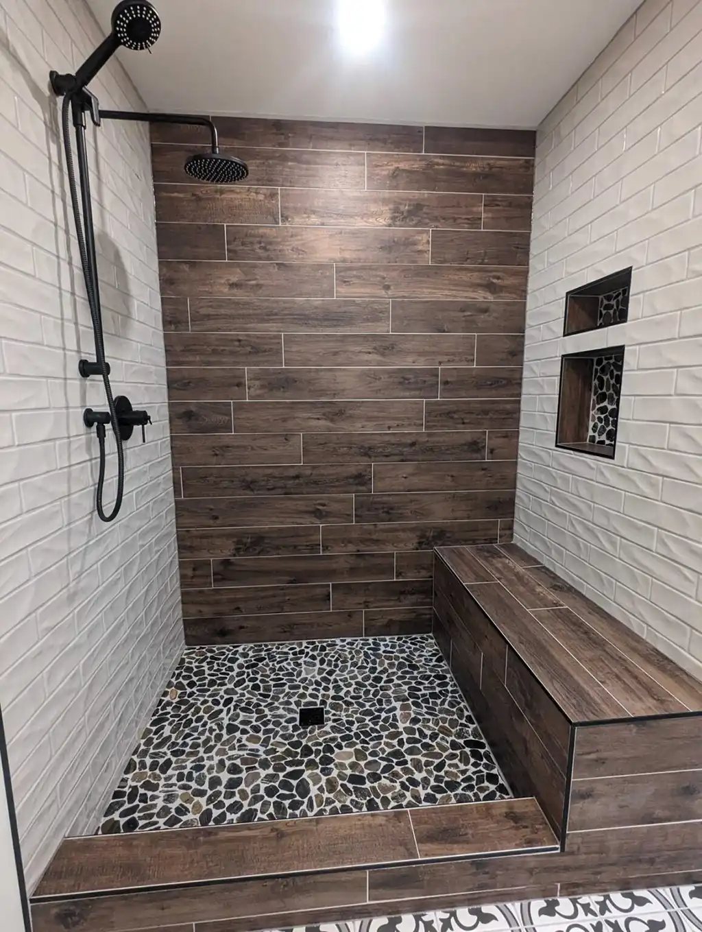 tiled shower with seat by Vision Project Services