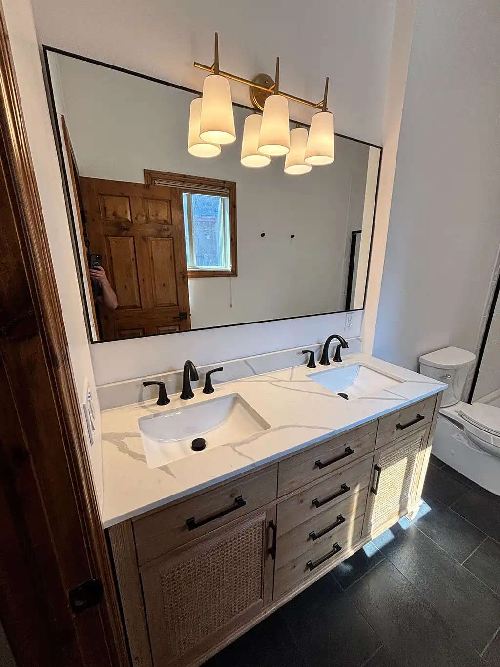 bathroom vanity with large mirror