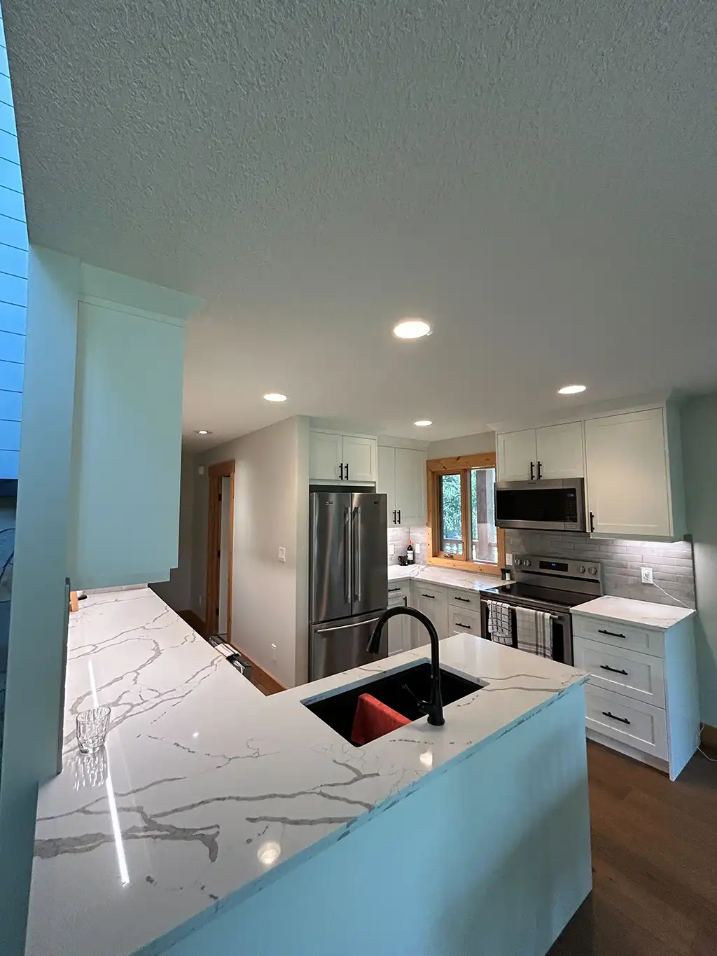 new kitchen with marbled countertops