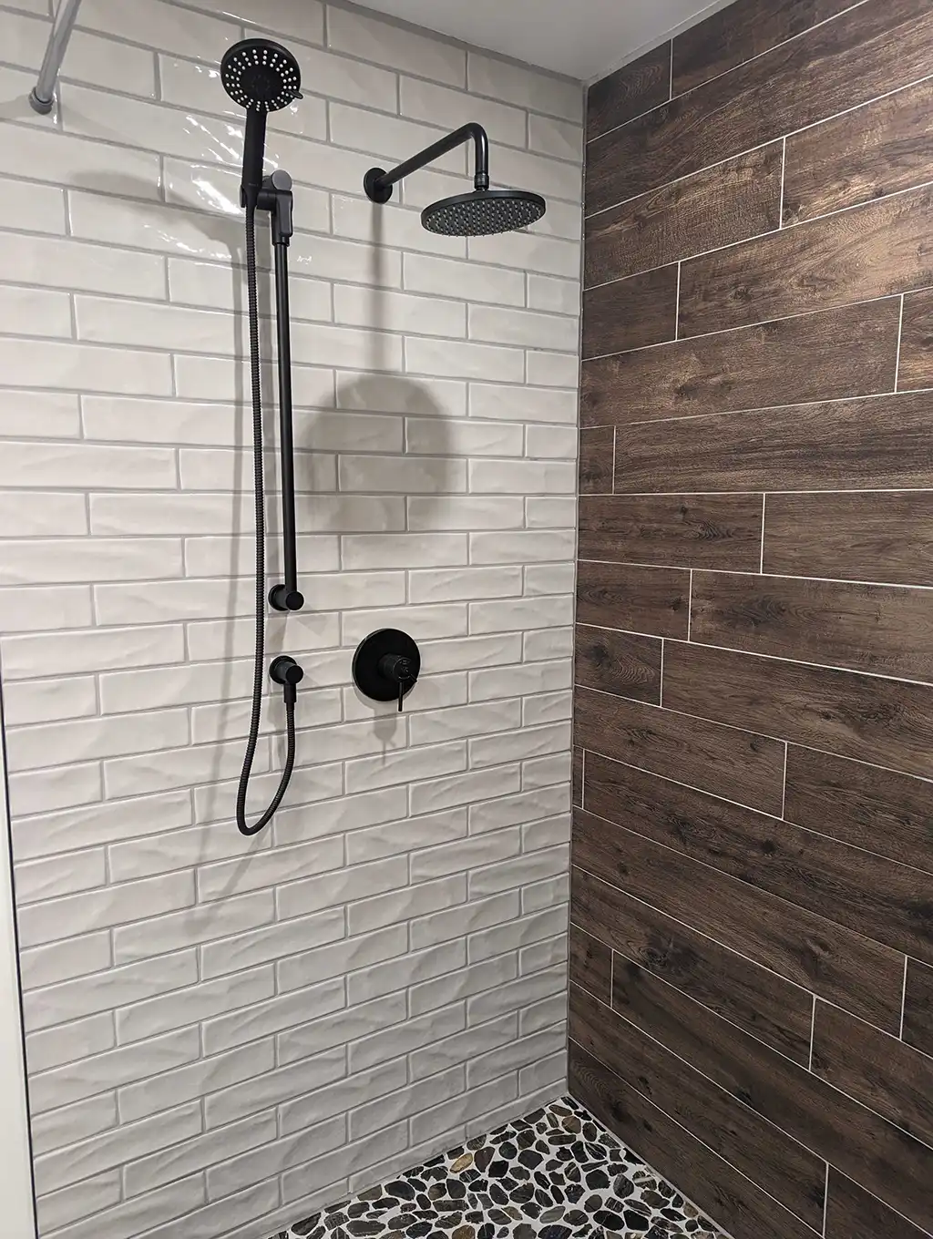 shower with tile and wood panels