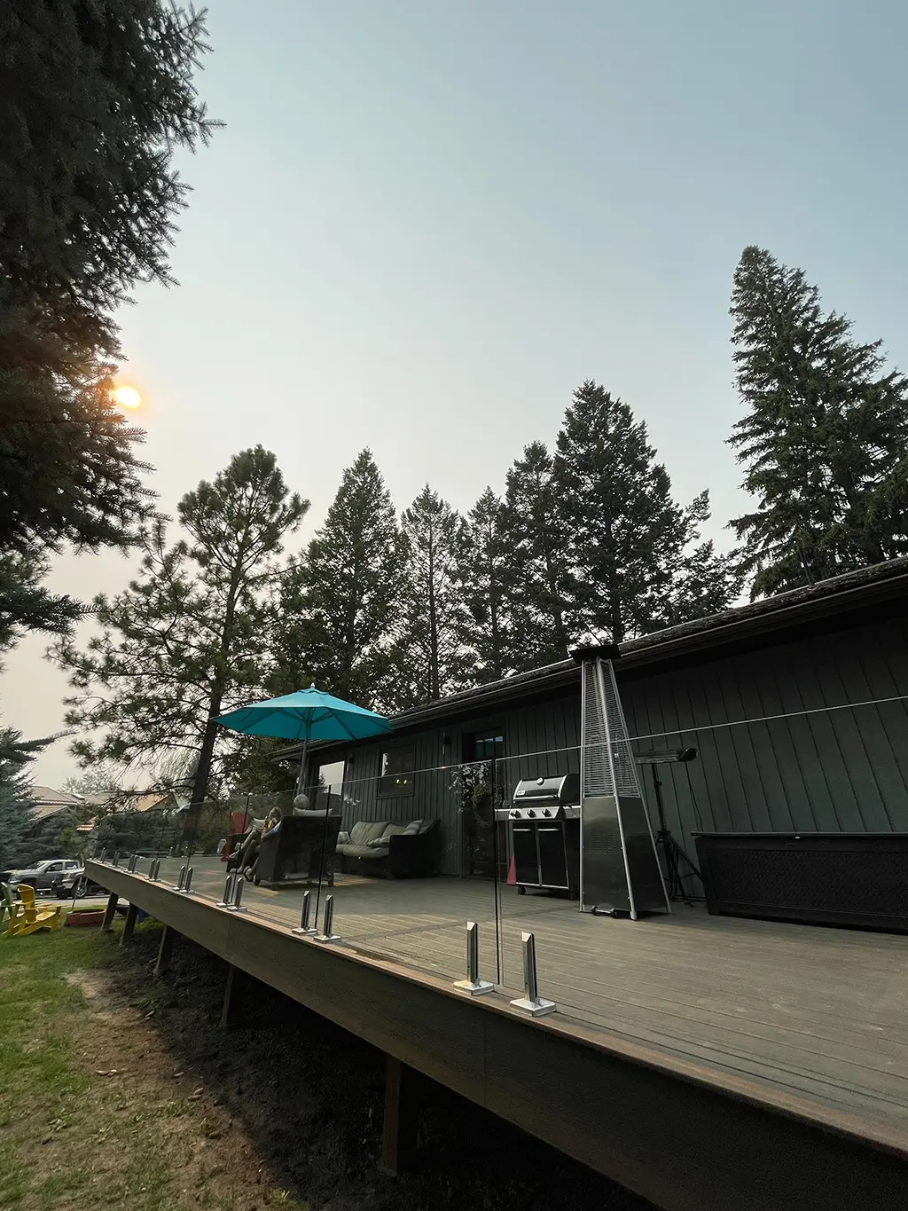 elevated deck with glass panel railing