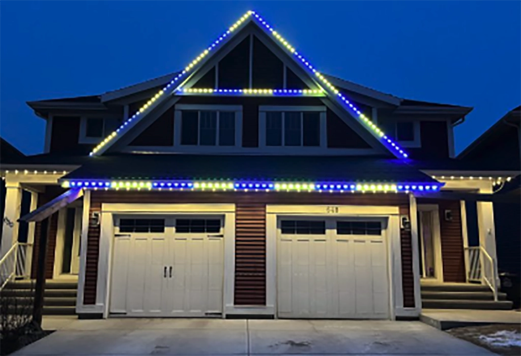 exterior of house with two garages and trim lights